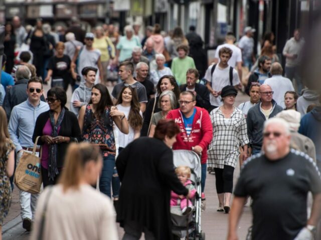 images shows variety of people in a UK street
