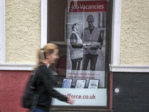 Woman walking past Job Centre