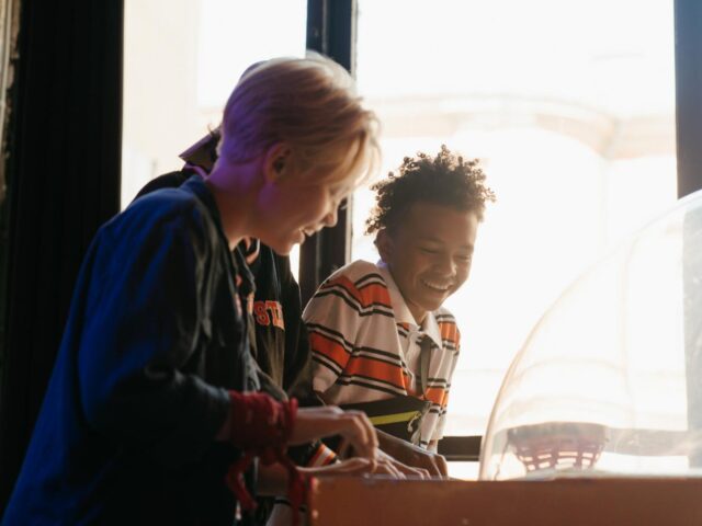 Photo of boys playing in arcade