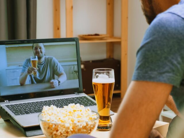 Photo of man drinking a beer