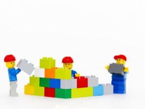 Photo of Lego people building a wall
