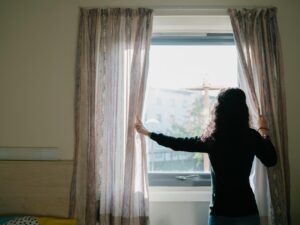 Women standing at a window