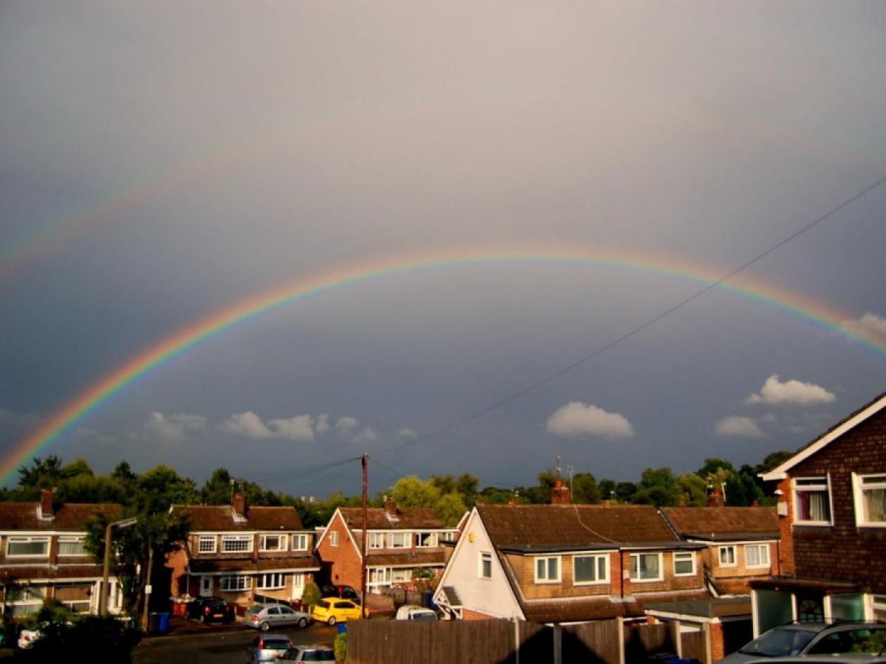 rainbow over houses