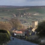 a church and village on an English country road
