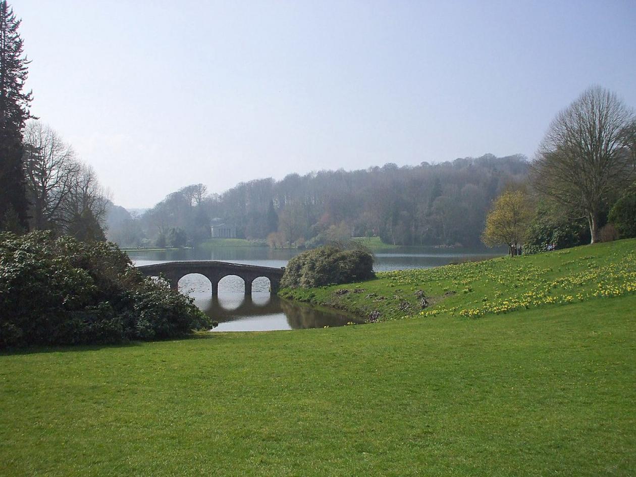 Stourhead in Wiltshire - the garden of a National Trust property showing a lawn leading down to a lake