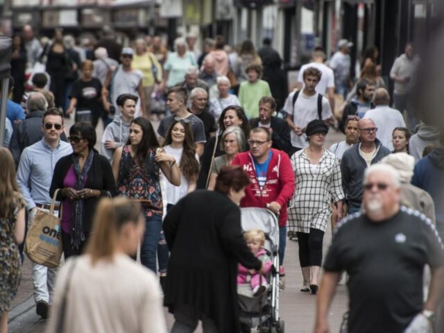 a crowd of people in a shopping area