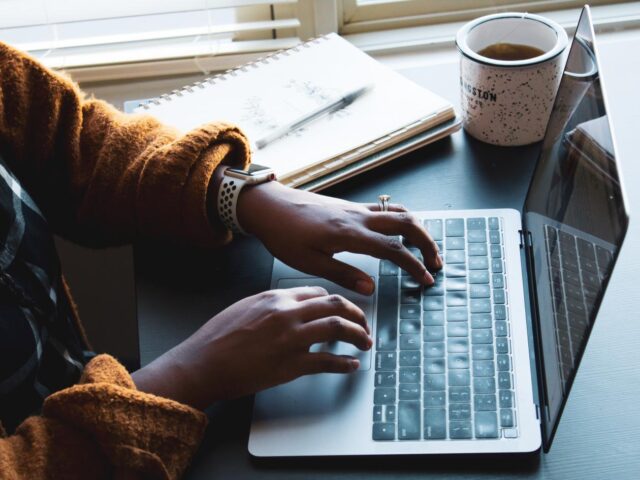 Photo of woman working on laptop