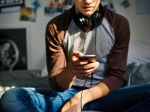 Photos of teenage boy on his phone